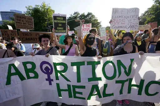 Demonstrators march and gather near the Texas state Capitol in Austin following the Supreme Court's decision to overturn Roe v. Wade on June 24, 2022. A pregnant Texas woman whose fetus has a fatal diagnosis asked a court Tuesday, Dec. 5, 2023, to let her terminate the pregnancy, bringing what her attorneys say is the first lawsuit of its kind in the U.S. since Roe v. Wade was overturned last year. (AP Photo/Eric Gay, File)