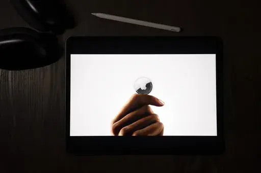 FILE -In this illustration photographed in La Habra, Calif., the AirTag tracking device is introduced during a virtual event held to announce new Apple products, Tuesday, April 20, 2021. Apple and Google on Tuesday, May 2, 2023, disclosed they are teaming up in an effort to thwart unwanted tracking on smartphones through Bluetooth devices designed to help people find their keys, keep tabs on their luggage and locate other things they don’t want to line. The two companies behind the iPhone and 