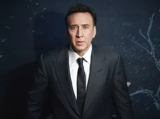 Nicolas Cage poses for a portrait to promote "The Unbearable Weight of Massive Talent" in New York on April 9, 2022. (Photo by Taylor Jewell/Invision/AP)