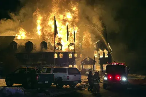 Firefighters battle an overnight blaze that destroyed the Lutsen Lodge on the North Shore of Lake Superior, early Tuesday, Feb. 6, 2024, in Lutsen, Minn. (Edward Vanegas via AP)