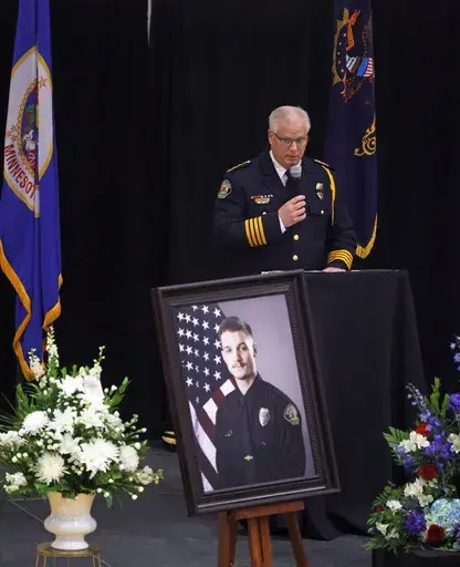 Fargo Police Chief David Zibolski speaks during funeral services for Fargo Police Officer Jake Wallin at Pequot Lakes High School in Pequot Lakes, Minn., on Saturday, July 22, 2023. Wallin, 23, was killed July 14 when a man armed with 1,800 rounds of ammunition, multiple guns and explosives ambushed officers responding to a routine traffic crash. (David Samson/Forum Communications Co. via AP, POOL)