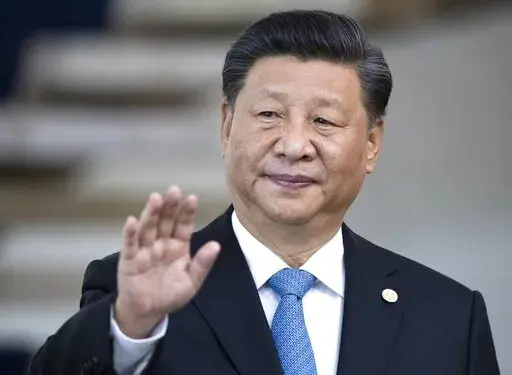 China's President Xi Jinping greets the media prior to a meeting of leaders of the BRICS emerging economies at the Itamaraty palace in Brasilia, Brazil, on Nov. 14, 2019. Xi is expected to meet his Russian counterpart Vladimir Putin during a visit to the neighboring Central Asian nations of Uzbekistan and Kazakhstan later in September 2022, in what would be his first overseas visits since the start of the COVID-19 outbreak in late 2019. (AP Photo/Pavel Golovkin, Pool, File)