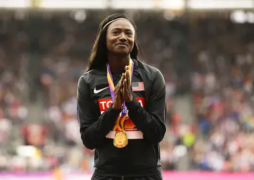 United States' Tori Bowie gestures after receiving the gold medal she won in the women's 100m final during the World Athletics Championships in London, Monday, Aug. 7, 2017. U.S. Olympic champion sprinter Tori Bowie died from complications of childbirth, according to an autopsy report. Bowie, who won three medals at the 2016 Rio de Janeiro Games, was found dead last month. She was 32. (AP Photo/Alastair Grant, File)