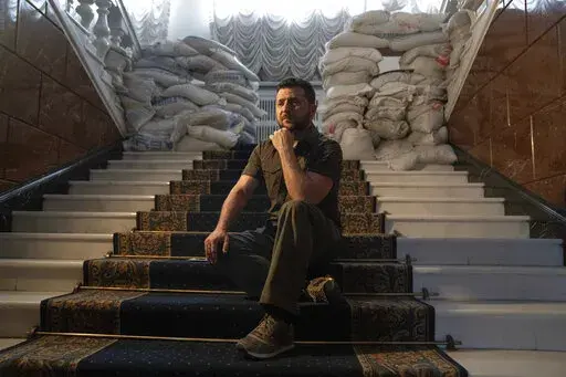 Ukrainian President Volodymyr Zelenskyy speaks during an interview with The Associated Press in his office in Kyiv, Ukraine, Saturday, April 9, 2022. A year ago, with Russian forces bearing down on Ukraine’s capital, Western leaders feared for the life of President Volodymyr Zelenskyy and the U.S. offered him an escape route. Zelenskyy declined, declaring his intent to stay and defend Ukraine’s independence. (AP Photo/Evgeniy Maloletka, File)