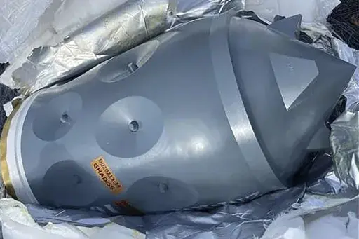 This image released by the U.S. Department of Justice in an FBI affidavit filed in U.S. District Court, Alexandria, Va., shows what is described as an Iranian-made warhead bound for Yemen's Houthi, seized off a vessel in the Arabian Sea. Four foreign nationals were charged Thursday, Feb. 22, 2024, with transporting suspected Iranian-made weapons on a vessel intercepted by U.S. naval forces in the Arabian Sea the previous month. Two Navy SEALs died during the mission. (U.S. Department of Justice 