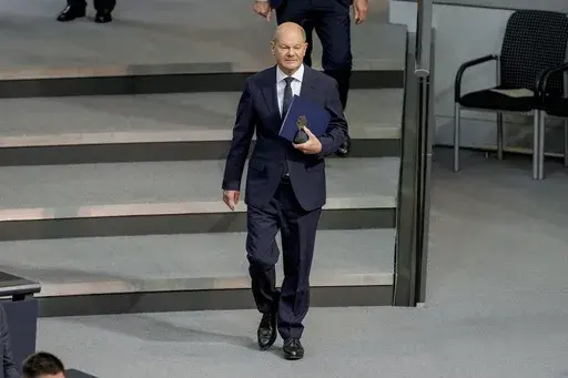 German Chancellor Olaf Scholz attends a plenary session in the German parliament Bundestag in Berlin, Germany, Wednesday, Nov. 13, 2024. (AP Photo/Markus Schreiber)
