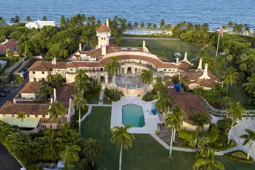An aerial view of President Donald Trump's Mar-a-Lago estate is seen Aug. 10, 2022, in Palm Beach, Fla. A witness in the criminal case against Donald Trump over the hoarding of classified documents retracted “prior false testimony” after switching lawyers last month and provided new information that implicated the former president, the Justice Department said Tuesday, Aug. 22, 2023. (AP Photo/Steve Helber, File)