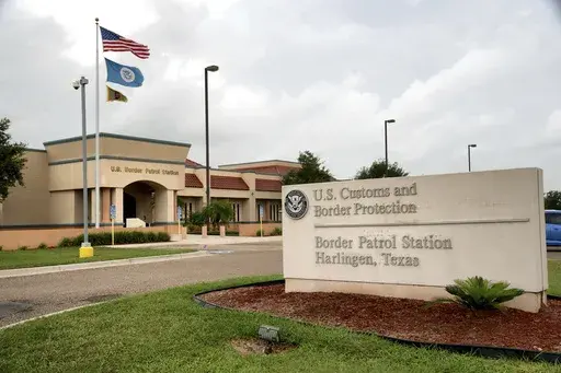 CORRECTS SPELLING TO DANAY, INSTEAD OF TANAY - FILE - The Border Patrol station stands July 11, 2014, in Harlingen, Texas. U.S. Customs and Border Protection has reassigned its chief medical officer after the in-custody death of an 8-year-old girl whose mother's pleas for an ambulance were ignored despite her daughter's chronic heart condition, rare blood disorder, high fever and other ailments, authorities said Thursday. Anadith Danay Reyes Alvarez was moved with family to a Border Patrol stati
