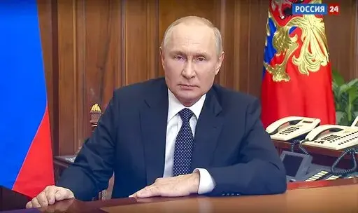 In this image made from a video released by the Russian Presidential Press Service, Russian President Vladimir Putin addresses the nation in Moscow, Russia, Wednesday, Sept. 21, 2022. (Russian Presidential Press Service via AP)