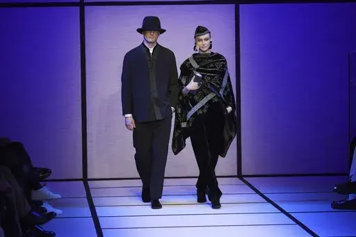 Models wear creations part of the men's Giorgio Armani Fall-Winter 2025-2026 collection, that was presented in Milan, Italy, Monday, Jan. 20, 2025. (AP Photo/Antonio Calanni)