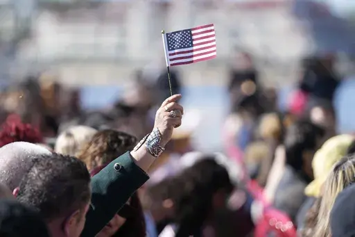 People recite an oath during a naturalization ceremony Wednesday, Feb. 15, 2023, in San Diego. Population estimates released Thursday, June 22, 2023, by the U.S. Census Bureau show what drove changes in different race and ethnic groups last year, as well as since the start of COVID-19's spread in the U.S. in April 2020. The United States had grown to 333.2 million people by the middle of last year, a 0.4% increase over the previous year, according to the 2022 population estimates. (AP Photo/Greg