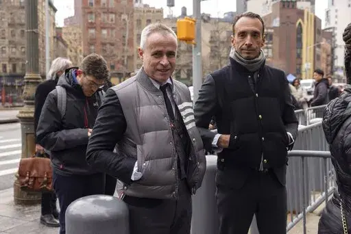 Fashion designer Thom Browne waits in line outside Manhattan federal court, Monday, Jan. 9, 2023, in New York. (AP Photo/Yuki Iwamura)