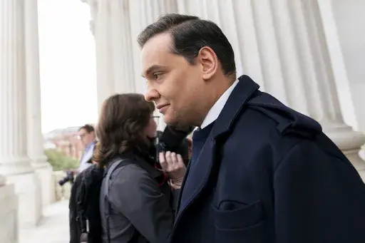 Rep. George Santos, R-N.Y., leaves the Capitol after being expelled from the House of Representatives, Friday, Dec. 1, 2023, in Washington. The House has voted to expel Santos following a critical ethics report on his conduct that included converting campaign donations for his own use, making him just the sixth member in the chamber’s history to be ousted by his colleagues. Expulsion requires support from two-third of the House. (AP Photo/Stephanie Scarbrough)