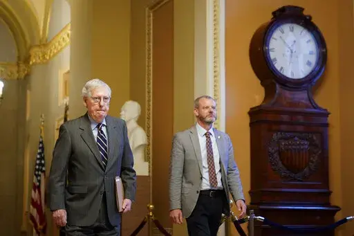 Senate Minority Leader Mitch McConnell of Ky., walks to the Senate Chamber on Capitol Hill in Washington, Thursday, June 9, 2022. (AP Photo/Patrick Semansky)