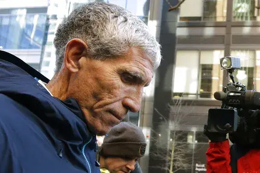 In this March 12, 2019, file photo, William "Rick" Singer, founder of the Edge College & Career Network, departs federal court in Boston after pleading guilty to charges in a nationwide college admissions bribery scandal. In the wake of the college admissions bribery scandal, experts say there’s little evidence that it stirred significant change in the world of college admissions. (AP Photo/Steven Senne, File)