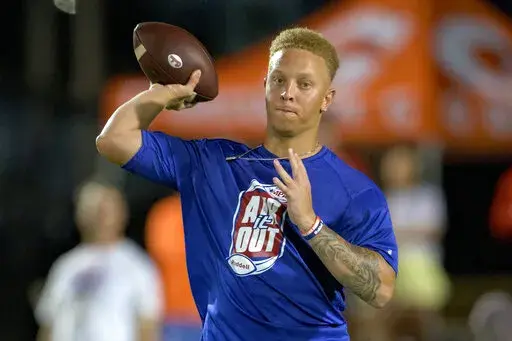 South Carolina quarterback Spencer Rattler throws at the Manning Passing Academy on the Nicholls State University campus in Thibodaux, La., June 24, 2022. In the offseason, one-time Oklahoma Heisman Trophy contender Rattler transferred to the University of South Carolina, one of several additions expected to add punch to the team. (AP Photo/Matthew Hinton, File)