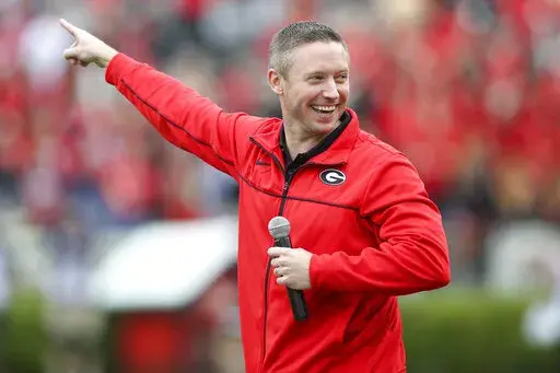 Georgia head basketball coach Mike White on the field before Georgia's spring NCAA college football game on April 16, 2022, in Athens, Ga. (AP Photo/Brett Davis, File)
